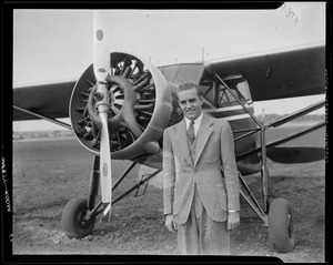 Randolph Hearst posing with an airplane