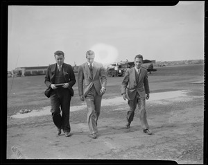 Randolph Hearst and two others walking from the airfield