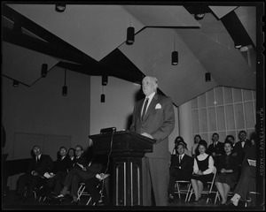 Harold G. Kern of the Hearst Papers is shown at the speaker's platform during the ceremonies officially opening the new Hearst Lounge at Boston University