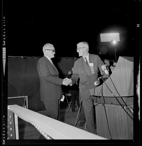 Presidential nominee Sen. Barry Goldwater shakes hands with Senator Leverett Saltonstall on the stage at the Republican rally in Fenway Park