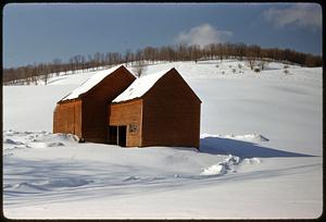 Barn on snow-covered hill