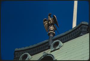 Gold eagle statue atop roof