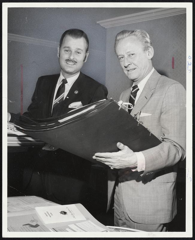 Herb Abramson (left), President of Silver Lake Dodge, Newton, receives
