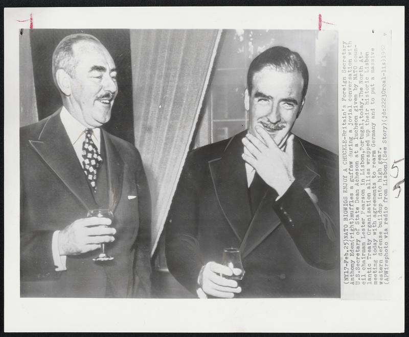 NATO Bigwigs Enjoy Chuckle- Britain's Foreign Secretary Anthony Eden (right) muffles a guffaw during a jovial conversation with U.S. Secretary of State Dean Acheson at a luncheon given by NATO council chairman Lester Pearson in Lisbon, Portugal, today. The North Atlantic Treaty Organization allies wrapped up their historic Lisbon meeting today with agreements to rearm Germany and to put a massive western defense buildup into high gear.