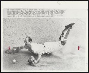 Crash Dive--Phillies catcher, Clay Dalrymple, dives head-first into the cinders behind home plate tonight in a vain effort to catch a foul ball hit by Willie McCovey of the San Francisco Giants in the fifth inning of the opening game of a double header in Philadelphia. The ball falls inches from his mitt. The Giants won the opener 10 to 2.