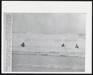 Three Hearty Souls-- These three men are enjoying the 8 to 10 ft. waves in the surf at Narragansett Pier today as Hurricane Gladys moved this way today.
