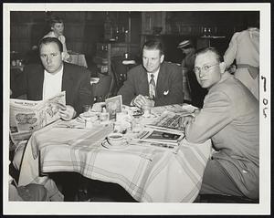 Waiting for the Light at Fenway Park and tonight's game with the Red Sox are these three members of the Detroit Tigers, who have just finished eating at the Hotel Kenmore. Left to right: Pitcher Virgil Trucks, Second Baseman Gerry Priddy and Pitcher Dizzy Trout, who will face the Sox Tomorrow.