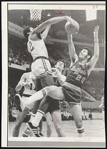 Boston Celtics guard Don Chaney grabs the ball from Buffalo Braves guard Dick Garrett