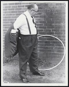 Don Carr, manager, F.W. Woolworth, Wollaston Branch, President Wollaston Businessmens’ Association, with hula hoop