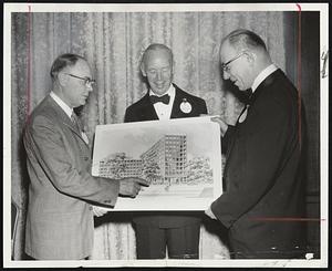Boston University medical alumni drive goal includes research building now under construction. Admiring sketch of completed facility are, left to right, Dr. Ronald Adams, Newton Centre, chairman; John A. Dunn, vice-president of planning and development at BU, and Dr. Andrew D. Elia, Jamaica Plain, retiring president of the Medical Alumni Assn.