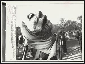 Death Mask of War--Demonstrators carry what they called a death mask of war among crowd of about 60,000 persons gathered for an anti-Vietnam war rally on Boston Common yesterday.