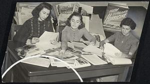 Top: Members of the Federal Writers' project busily engaged in sorting photographs and reports that came from all over New England.