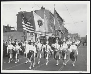 Young Color Guards and Military Detachments blended to make yesterday's South Boston line of march complete. Above are the young woman of the Immaculate Conception Church of Woburn and Winchester, as they swung along Boradway.