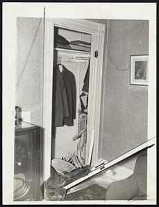 The 200-pound rock Which crashed through a 2-foot wall in the home of Orol H. Sornberger. 3 Carter street, Woburn, landing in a closet and breaking down the door. Notice the arm seat, which Sornberger had just left. The rock was propelled through the air for a distance of more than 3500 feet from the General Crushes Stone Company quarry by a dynamite blast.