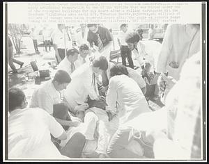 Doctors at Veterans Administration Hospital apply artificial respiration to one of the victims that was buried under one of the collapsed buildings for six hours after a rolling earthquake hit the Southern California area early 2/9. Numerous deaths, injuries, and millions of dollars of damage were being reported hours after the quake as reports began coming in from all sections of Southern California.