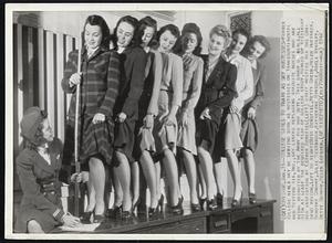 College Girls to Train As Sky Hostesses-Former college girls may be serving soon as hostesses on Transcontinental and Western Air, Inc., sky liners replacing graduate nurses who are being recruited by the Army for war duty. This group of girls, all with at least the required year of college study, turned up yesterday for inspection by Esther Benefiel (left) chief hostess for the Chicago region.Left to right: Miss Benefiel, Hetty Green, Helen Huffaker, Dorothy Conway, Julie Westbrook, Katherine Hinsdale, Adele Mikolay, Betty Durham, Helen Lofgren.
