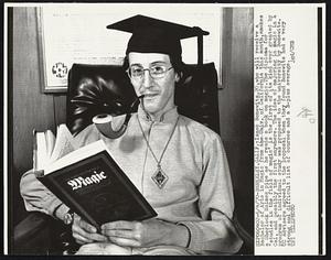 Isaac Bonewits, 20, who will receive a Bachelor of Arts in Magic from the Univ. of California this month, smokes a Sherlock Holmes pipe as he reads a book on magic. The diploma for "studies in the field of magic" is the first of its kind ever granted by Cal, and possibly the first anywhere. The idea of majoring in magic in a program of individual study was proposed to the university by Bonewits. UC advisers agreed to the proposal when they found Bonewits had a very strong and difficult list of courses and a B-plus average.