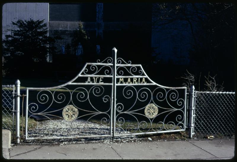 A gate with "Ave Maria" on it