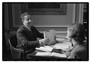 A man seated at a desk