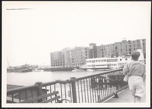 Woman walking over a bridge