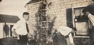 Three men at the Chase house, George H. Chase in center, West Yarmouth, Mass.
