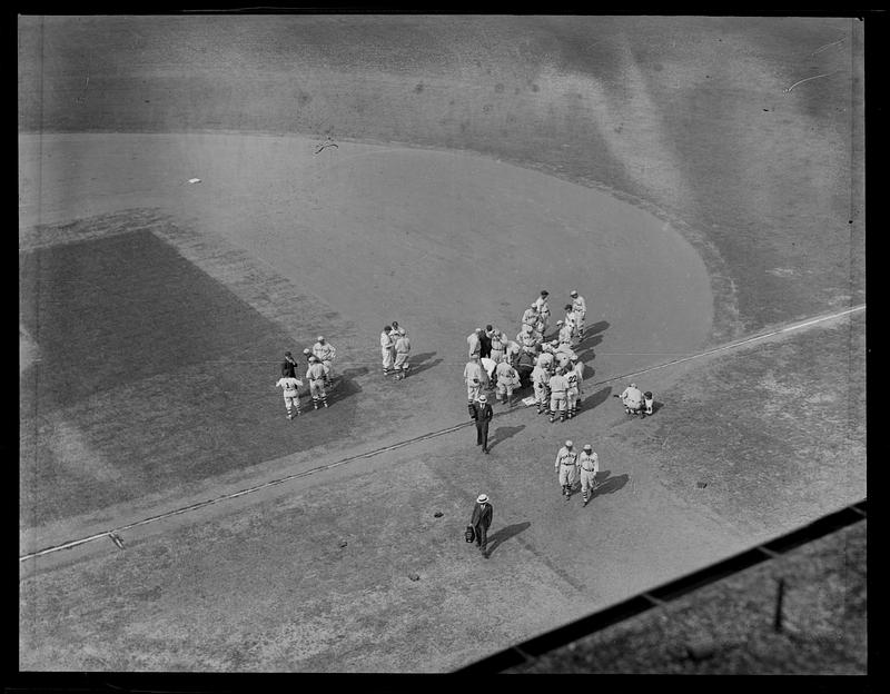 Boston Braves and New York Giants gather around first base