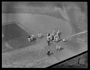 Boston Braves and New York Giants gather around first base