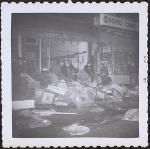 Men clearing garbage from sidewalk, Boston