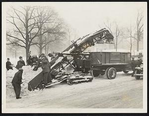 "Snow-eater" rapidly clearing snow yesterday on Boylston street, near Park square.