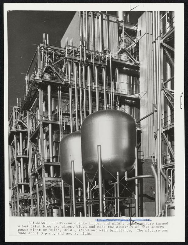 Brilliant Effect --- An orange filter and slight underexposure turned a beautiful blue sky almost black and made the aluminium of this modern power plant at Tulsa, Okla., stand out with brilliance. The picture was made about 3 p.m., and not at night.