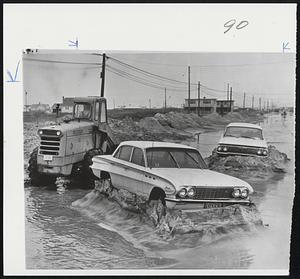 Sand Pedestals Abandoned Autos are left perched atop pedestals of sand as road grading equipment clears sand from storm-swept highway yesterday in North beach, N.J., one of the hardest hit communities on Long Beach Island.