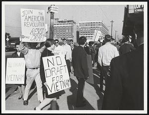 Army Base Protest – Protesting the draft and the war in Vietnam were these people who marched outside the Boston Army Base Wednesday.