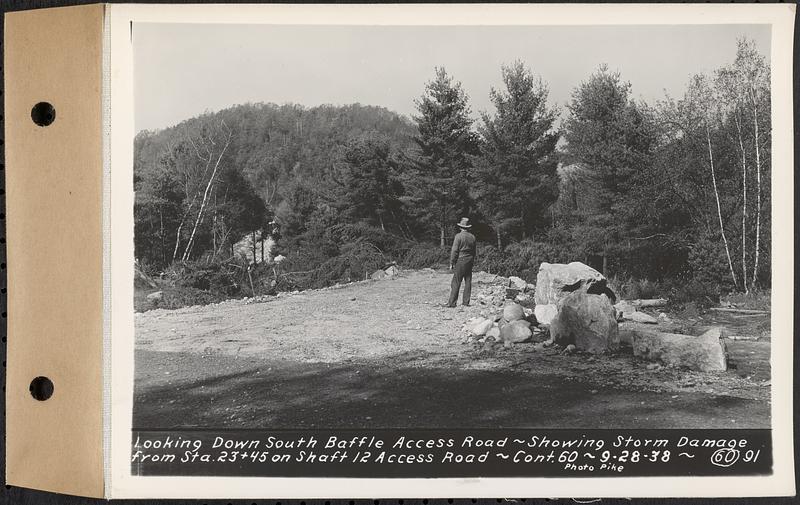 Contract No. 60, Access Roads to Shaft 12, Quabbin Aqueduct, Hardwick and Greenwich, looking down south Baffle access road, showing storm damage from Sta. 23+45 on Shaft 12 access road, Greenwich and Hardwick, Mass., Sep. 28, 1938