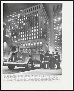 Just in Case -- New York City Fire Department apparatus and men stand at the ready in New York's Rockefeller Plaza during rush hour tonight as subway and bus strike snarled traffic. The Fire Department deployed units in strategic points throughout the city during the crush.