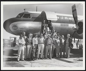 Emergency Line Repairmen-Twenty-three emergency linemen from the Ohio Power Co. disembark from their chartered plane at Boston Airport. They were flown in to assist Boston Edison Co. field forces pressing to complete the bulk of the service restoration job after Hurricane Ed na.