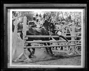 Rider being thrown off of a horse