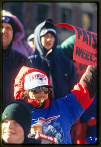 Boston City Hall Plaza (circa 1997) a New England Patriots fan holds up a sign