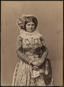 Studio portrait of woman in traditional Greek dress