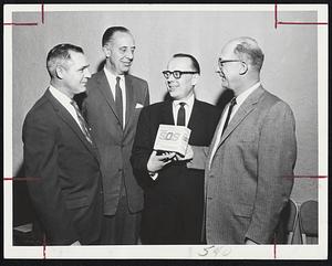 Advertising program for new blue SOS Soap Pads with rust inhibitor was discussed at recent sales meeting of Abbott, Hall and Co. and SOS division of General Foods Corp. at Hotel Madison. Pictured from left are, Tom Hughes of SOS; Robert Abbott of Abbott, Hall; Henry P. Latte of SOS; and George Hall of Abbott, Hall.