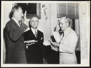 Acheson Becomes Undersecretary of State-- Dean G. Acheson (left) is sworn in as undersecretary of state today by James E. McKenna, (right) special assistant to the secretary of state, in a ceremony witnessed by Secretary of State James F. Byrnes (center).