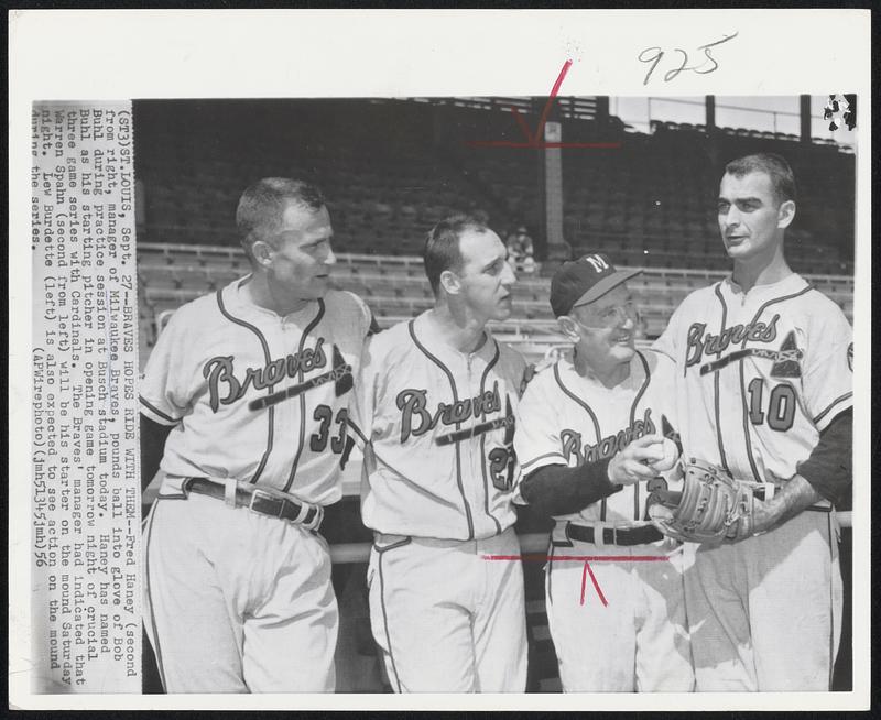 Braves Hopes Ride With Them--Fred Haney (second from right, manager of Milwaukee Braves, pounds ball into glove of Bob Buhl during practice session at Busch stadium today. Haney has named Buhl as his starting pitcher in opening game tomorrow night of crucial three game series with Cardinals. The Braves' manager had indicated that Warren Spahn (second from left) will be his starter on the mound Saturday night. Lew Burdette (left) is also expected to see action on the mound during the series.