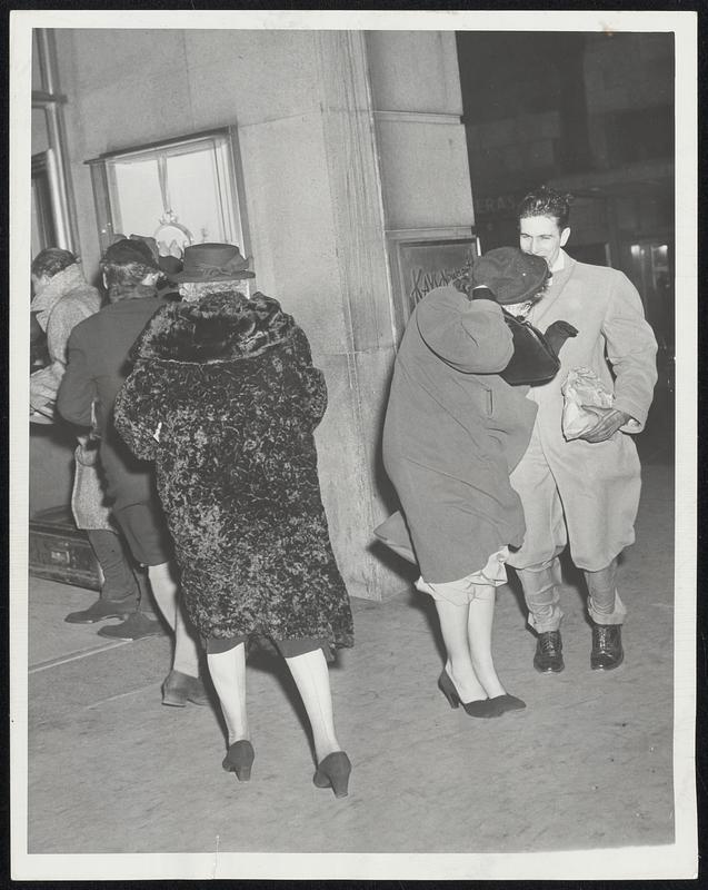 Fighting The Northwest Gale in downtown Boston yesterday meant holding