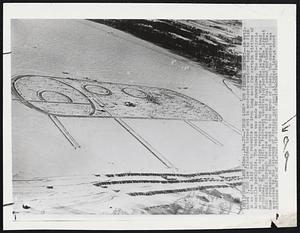 "Iron Lung" Ice Fishing Contest -- An estimated 3,500 ice fishermen turned out in near-zero weather today to fish in an area laid out to resemble an iron lung used for certain victims of infantile paralysis. The design was made by snowplows. The semi-circle at one end of the design represents the place where the patient's head protrudes. The two circles represent observation portholes. The largest fish caught through the ice was a five and a half pound northern pike. Some proceeds of the event went to the March of Dimes. The contest was sponsored by the Veterans of Foreign Wars post at Forest Lake, a short distance north of St. Paul.