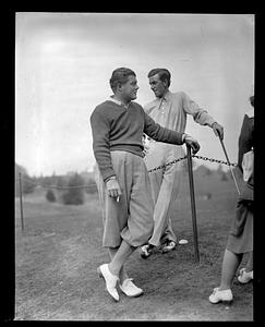 Two golfers dashing