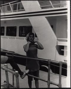 Woman standing in front of a ship