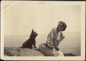 Helen Stevens Coolidge sitting with dog (possibly "Ping") at beach