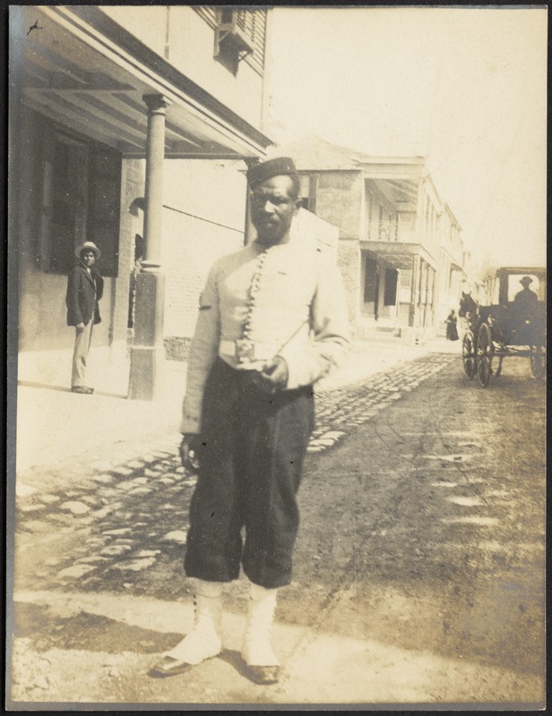Man in uniform standing in street