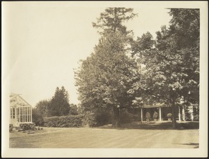 Greenhouse, grounds, side porch of house