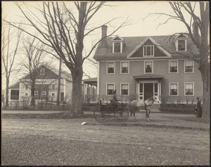 Ashdale Farm. Copy of early photo of Gertrude Stevens in horse and buggy in front of main house; barn on left; woman standing near tree on far right.
