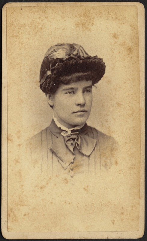 Young woman wearing ornate bonnet